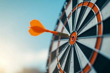 Orange dart arrow hitting bullseye in center target of dartboard on blue sky background with copy space. Business, strategy, achievement, and planning concept - Powered by Adobe