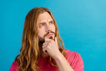 Photo of creative intelligent person arm touch chin look focused empty space ponder isolated on...