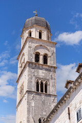 Fototapeta na wymiar Medieval Church of St Francis with bell tower located in the main street Stradun, Dubrovnik, Croatia