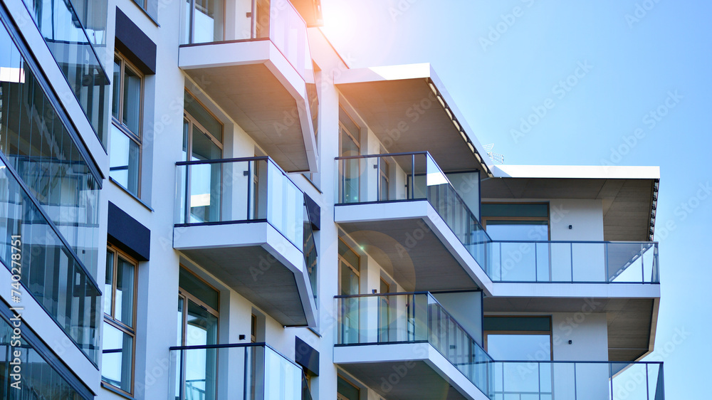 Wall mural Modern architecture of urban residential apartment building. Apartment building exterior, residential house facade.