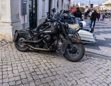 A Harley Davison motorbike looking in need of repair.Often referred to as rat bikes, maintained at low cost or styled to look like a rat bike