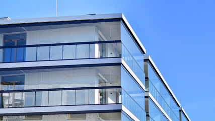 Obraz premium Modern architecture of urban residential apartment building. Apartment building exterior, residential house facade.