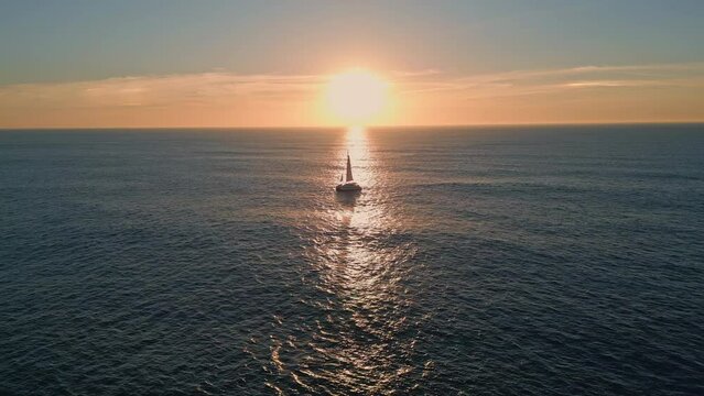 Sailboat floating ocean sunset drone view. Silhouette sailing boat at sunlight