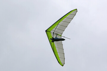 Hang Glider flying in a cloudy sky	