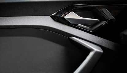 Modern silver car door handle interior. Arm rest. Car interior.