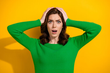 Photo of impressed worried nervous woman two ms touch head open mouth bad news isolated on yellow...