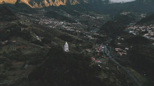 Drone flight at Nossa Senhora de Fatima Chapel, Madeira near Sao Vicente with the Chapel in view and a camera tilt upwards to the mountains