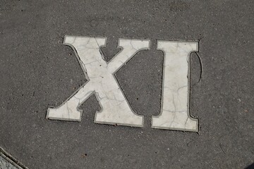 stone carved roman number , antique  cracked cconcrete