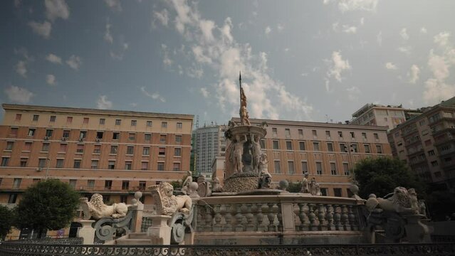 Naples, Italy - 08 02 2023 : Neptune fountain in Naples- Italy, The famous Fountain of Neptune located at Municipio square in Naples built on 1600, Idyllic fountain in public park at springtime, 