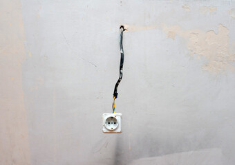Antique construction rosette, hanging rosette. Electrical wiring in plaster, rough finish on the...