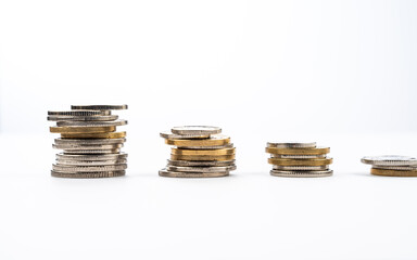 Polish currency. Polish zloty coins stacked on each other in different positions. Money concept on white background