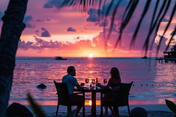 Obraz premium A couple enjoying a romantic sunset dinner on a beach