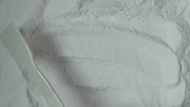 Food additive E466, texture surface, close-up. Sodium Carboxymethyl Cellulose Powder, Na CMC. Carboxymethylcellulose, carmellose, or croscarmellose powder.