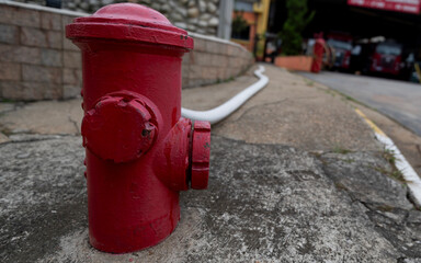 Fototapeta na wymiar Hydrant with hose connected and stretched