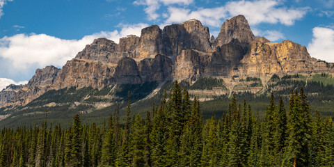 Summer time stunning views at Castle Mountain in Banff National Park with views along the turquoise Bow River in Alberta. Beautiful blue sky day with clouds. 