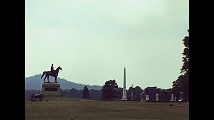 Gettysburg, Pennsylvania, United States - in 1980: The historical Gettysburg national military park cemetery of USA in 80s archival. Statue of General George Meade and State of Pennsylvania Monument. - Powered by Adobe