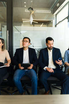 Group of businessman sitting and waiting for their job interview