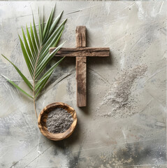 Wooden cross, bowl with ash and palm leaf on gray background