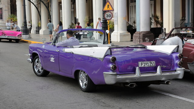 Old purple and white almendron car -yank tank, Dodge American classic- from 1957 on the Paseo del Prado promenade. Havana-Cuba-015