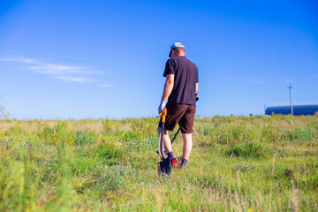 treasure hunter in the field looking for old coins and artifacts