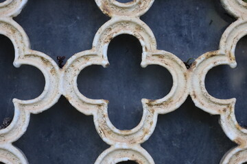 ancient rusty wrought ornamented metal surface