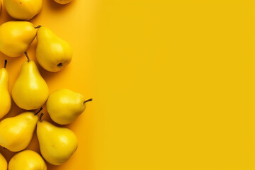 Several yellow pears on a bright yellow background