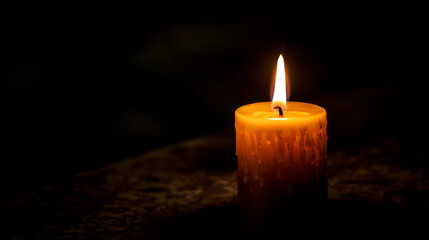 Obraz na płótnie Canvas Close-up of a single unlit candle in a dark room.