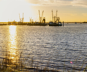 Fototapeta premium Shrimp Boats on The Amelia River at Sunset, Fernandina City, Amelia Island, Florida, USA
