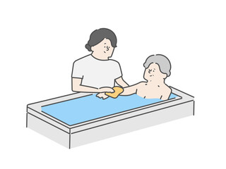 高齢女性の入浴介助をする女性介護士