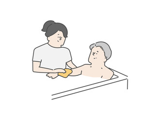 高齢男性の入浴介助をする女性介護士