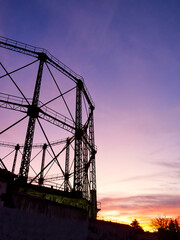 Gas tank in abandoned factory in sunset colours. Gazi, Athens, Greece 