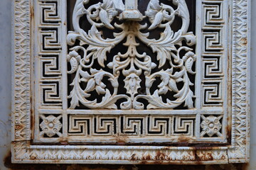 close up ancient weathered wrought metal  ornaments 