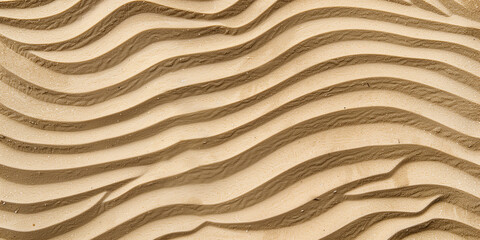 Wavy patterns on sand dunes captured in detail, showing the natural artistry and texture of wind-shaped landscapes.