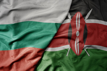 Obraz premium big waving national colorful flag of kenya and national flag of bulgaria .