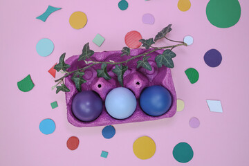 Easter decoration with colored eggs in a box 