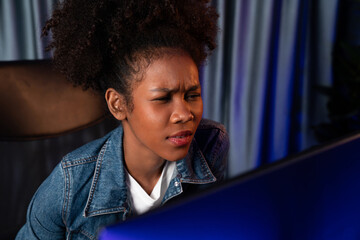 Young African American creator woman with serious face, thinking carefully and looking at final...