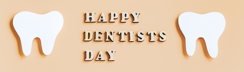 International Dentist Day. Eco-friendly wooden toothbrushes on beige background. Dental care concept.