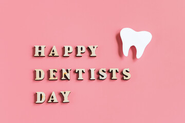 Mockup of tooth on pink background. Happy dentist day. Dental care concept.