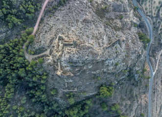 Aerial view of Pliego town and medieval castle in Southern Spain, ruined walls made of rammed earth with Arab origin