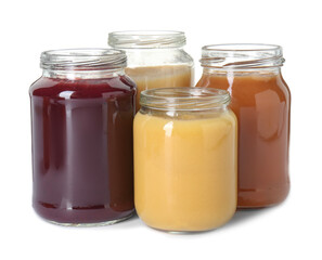 Baby food. Different healthy puree in jars isolated on white