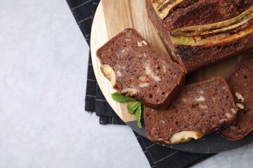 Delicious banana bread on grey table, top view. Space for text