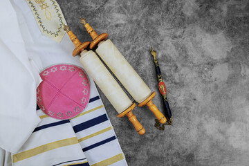 Orthodox Jewish holiday symbols: prayer shawl tallit, prayer holy torah scroll, kippah