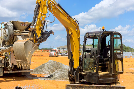 Excavator working on an industrial site under infrastructure development