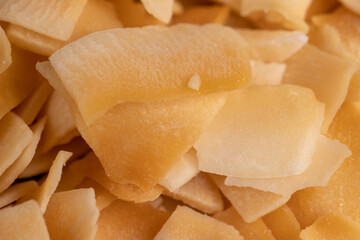 sweet orange and yellow coconut flakes fried in sugar