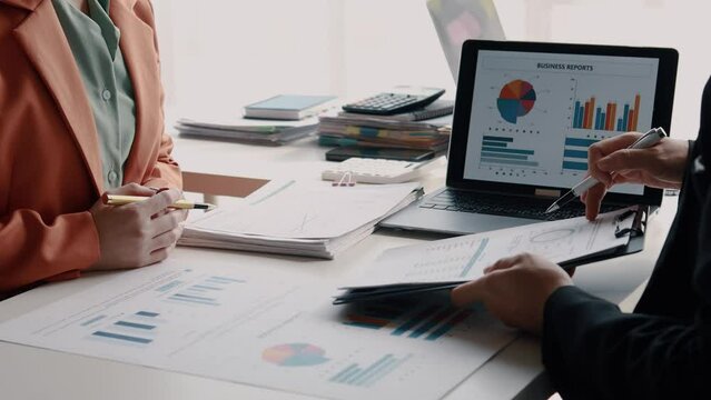 Atmosphere of a startup company meeting, business people are meeting together to summarize and plan investment finances, they are the founders of the company. Business administration concept.