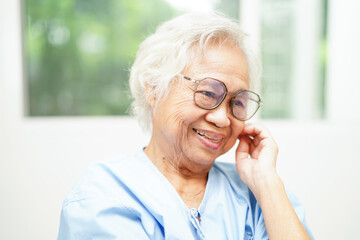 Asian senior woman wearing eyeglasses or vision glasses at home care service.