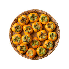 Fresh persimmon fruit in natural basket, Autumn seasonal fruit, Top view