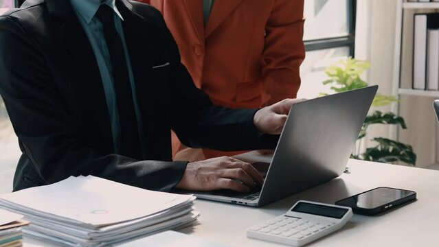 Atmosphere of a startup company meeting, business people are meeting together to summarize and plan investment finances, they are the founders of the company. Business administration concept.