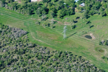 Aerial view of Electrical Power Lines and Transmission Towers in the Hill Country of Texas near...