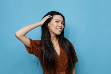 Fototapeta premium Woman smile asian background blue girl happy studio trendy